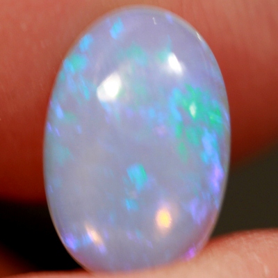 SOLID CRYSTAL OPAL Transparent with purple sparkles over a purple hue